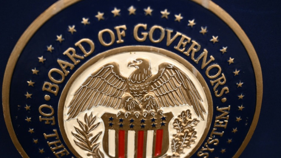 Gold hits record, stocks mixed as Trump fuels Fed fears