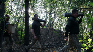 Russia kills 21 in east Ukraine during pension distribution, Zelensky says