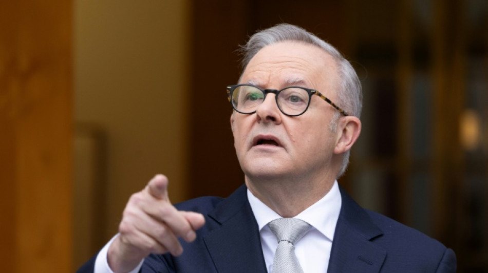 Australian PM lures voters with supermarket crackdown