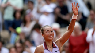 Olympic champion Zheng battles into French Open last eight