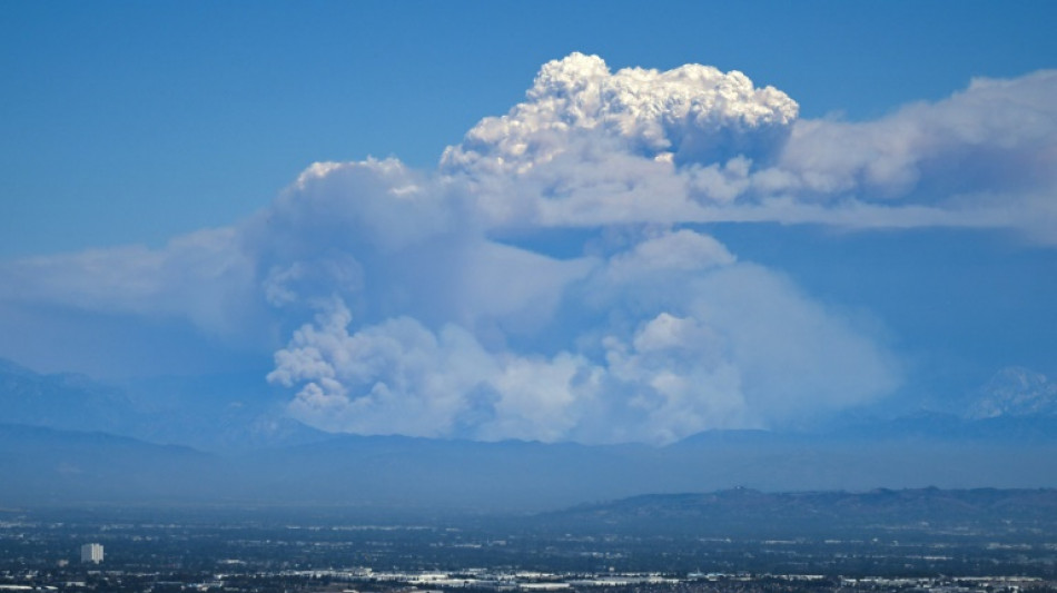 Wildfires around Los Angeles blanket city in smoke