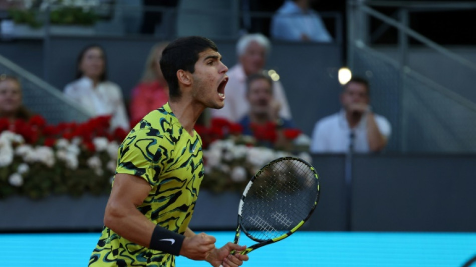Alcaraz retains Madrid Open title in battling win over Struff