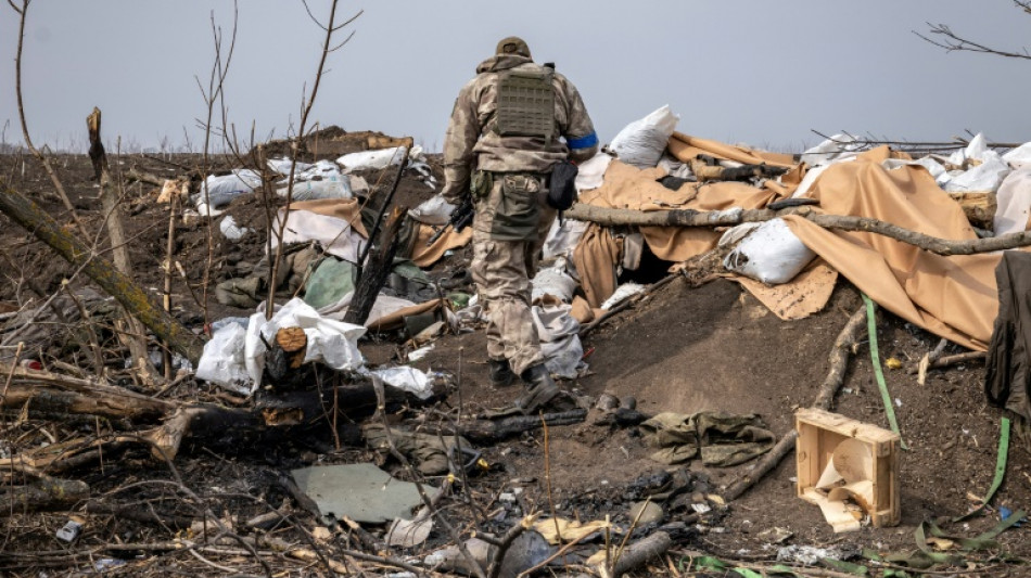 Ukraine retakes Kyiv suburb, as talks resume under shadow