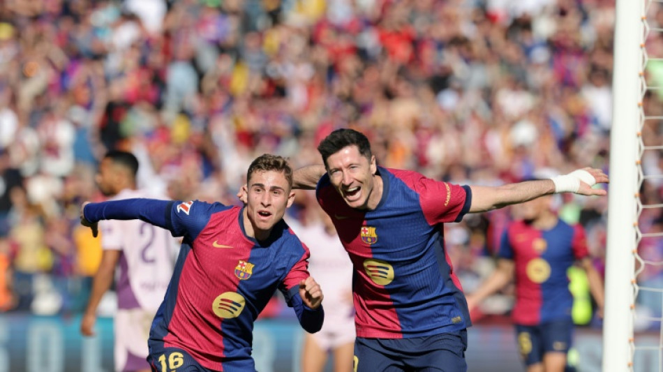 Barca restore Liga lead in Girona romp
