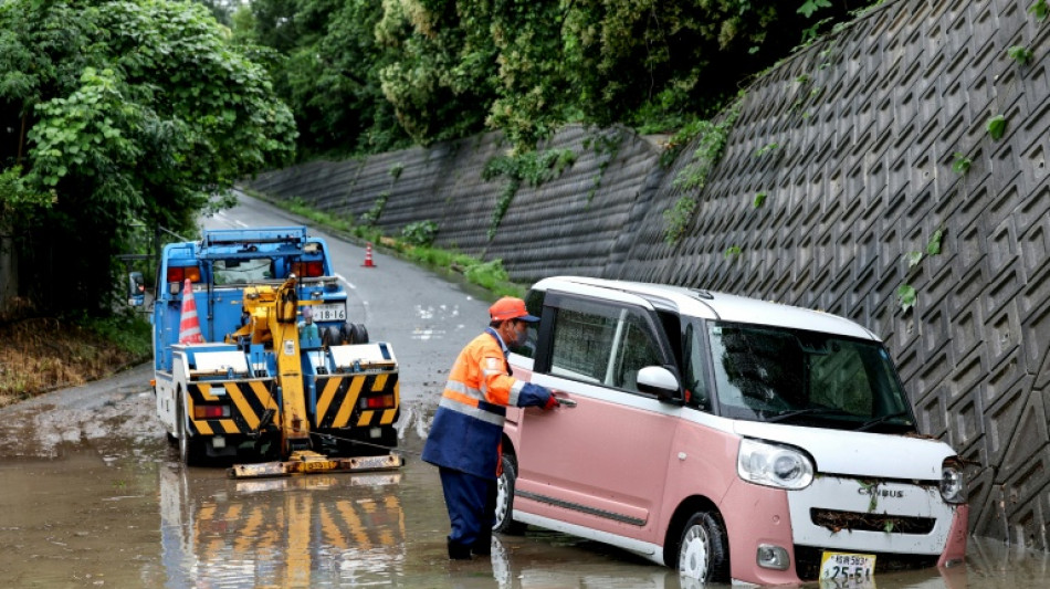 Floods kill two in Taiwan as twin storms approach Japan